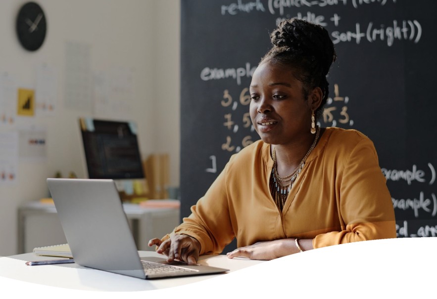 Educator working on laptop