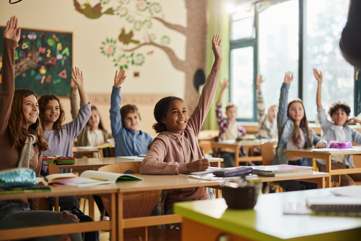Attendance DailySpark Image Students engaging in the classroom
